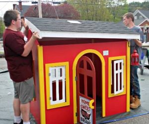 Habitat for Humanity volunteers build playhouses for families of veterans