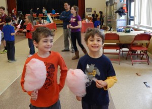 First-grade brothers William (left) and Jacob Nealon enjoy some cotton candy.