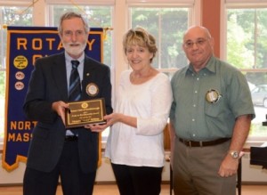 Rotarian George Pember (l) and Rotary President Chuck Frankian present Vickie Killeen with the 