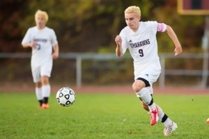 Algonquin senior Tyler Morin chases down a ball in the first half of a game against Westborough.