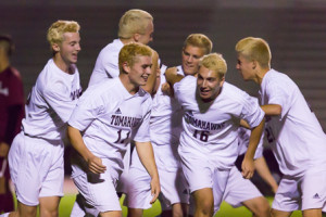 Algonquin boys soccer team members celebrate after a goal by Zach Osetek.  Team members traditionally dye their hair blonde for the playoffs.