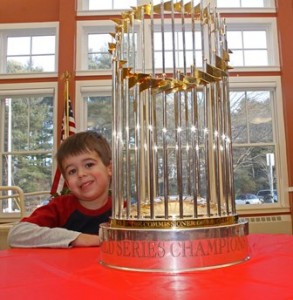 Jason Mikula, 4, of Marlborough with the World Series trophy.