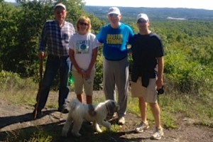 (l to r) Don Dodson, Linda Corbett, Wade Robbins and Ron Ellis (with his dog, Augie) hike Northborough's Mount Pisgah hiking trail. (Photo/submitted)