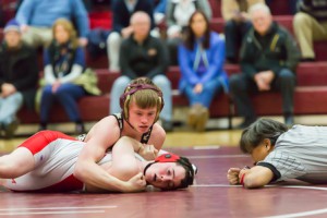 Algonquin’s Austin Roche works to pin Catholic Memorial’s Kevin Hern