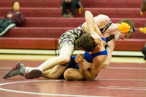 Algonquin’s Bryce Finnegan prepares to pin Leominster’s Anthony Larson.
