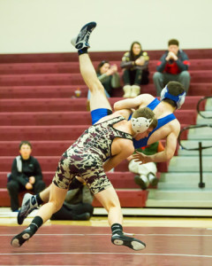 Algonquin’s Drew Cozzolino throws Leominster’s Christian Curll.