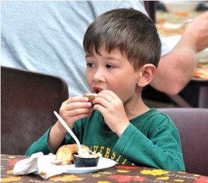 A.J. Mastromarchi, 5, samples apple crisp, pumpkin whoopee pie and a cider donut.