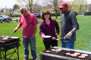 Northborough Selectman Jeff Amberson, Community Affairs Committee Kair Tucker and Town Moderator Fred George work the grills at the cookout.