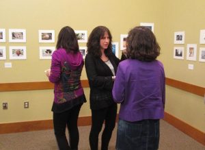 Guests and students mingle at the beginning photography class reception April 16 at the Northborough Free Library. (Photo/Alexandra Molnar)