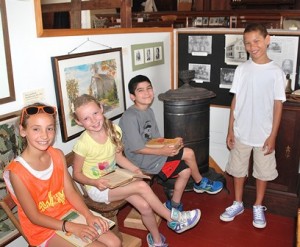 Fannie E. Proctor Elementary School third-graders (l to r) Isabelle Neilson, Caroline Quinlan, Mark Stamoulis and Jovoni Mobley visit the Northborough Historical Society Museum. Photo/Ed Karvoski Jr. 