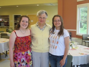 Volunteers Eileen Moynihan (left) and Kelly Harrison (right) pose for a photo with Adrienne Cost, the chair of the Northborough Council on Aging.  Photo/Bonnie Adams 