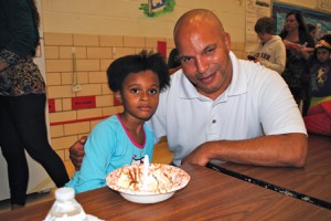 Jacquelyn Allen enjoys an ice cream sundae with her dad, Roland Allen. 