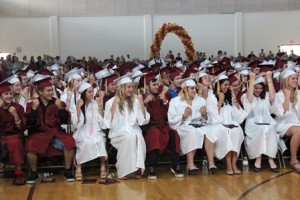 Graduates show their enthusiasm during the ceremony.