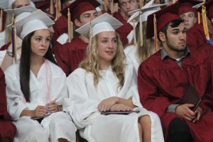 Diplomas in hand, graduates await the post-graduation festivities.