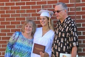 A graduate poses with members of her proud family