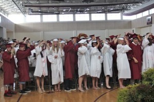 ARHS graduates participate in the traditional moving of the tassels to mark the occasion.