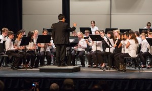 David Daquil leads the Melican Middle School sixth-grade band at the MICCA Concert and Choral Festival.