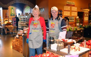 Representing New York Apple Growers, Roger and Ingrid LaMont of Roger LaMont Farm introduce shoppers to SnapDragon apples at the Wegmans Food Market in Northborough. Photo/Michelle Murdock 