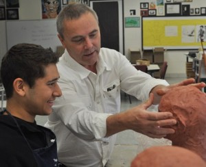 Gustavo Gonsales, from Marlborough, gets some advice on his clay sculpture from David Stockbridge. (Photo/submitted)