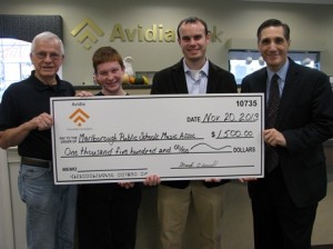 David Morticelli (right), AVP market manager of Avidia Bank, presents $1,500 to (l to r) Lee Woodworth, Marlborough Public Schools Music Association Special Projects; Kyle Cook, Whitcomb Middle School student; and Simon Harding, Whitcomb Middle School band director. Cook will be learning to play the bassoon purchased with the donation.(Photo/submitted)