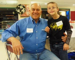 Steven Sager, a volunteer with the Rotary Club of Westborough, with his Little for the day, Christian 