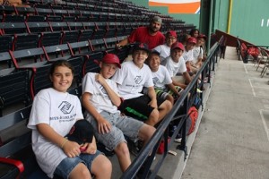 Kids from the Boys & Girls Clubs of MetroWest's Marlborough division pose in the Fenway Park seats.