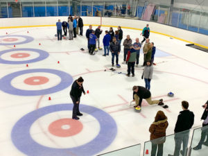 Business leaders enjoy networking and curling
