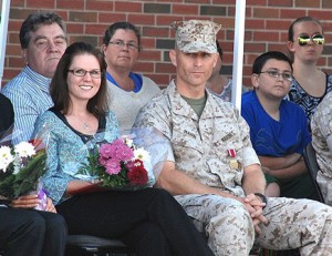 Kelly and her husband, Chief Warrant Officer 3 Randolph P. Mann, watch the cadets perform a drill.
