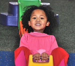 Kayla Onyango, 4, of Marlborough rides a miniature roller coaster.