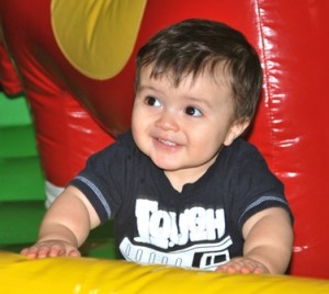Ethan Isaza, 14 months, of Northborough spots his mom while playing.