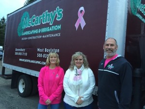 Sue and Roger McCarthy, owners of McCarthy Landscaping and Irrigation, stand with Linda Halloran (center) on the day they presented a $2,000 check in support of the nonprofit organization Halloran co-founded, The Breast Friends Connection. Photo/Lori Berkey 