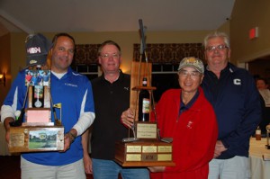 Photo: (l to r) Mike McDonagh, Scott Buckley, David Wong and Mark Noack of “ICS 1” took first place in the 2014 One Ball Two Strikes Greg Montalbano Golf Classic. The tournament’s two-tiered walnut trophy features a bottle of Chianti Montalbano, which the late pitcher autographed while still playing professional baseball. (Photo/Kristen Montalbano)