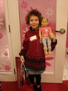 This girl is thrilled to attend an American Girl party, thanks to the Rise Above Foundation 