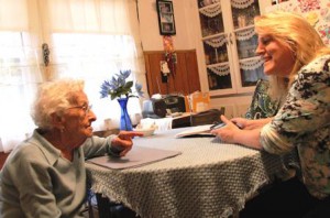 SALMON VNA & Hospice nurse Kathy Schrader shares a laugh with patient Louise Furcinitti in her Milford home.  Photo/submitted