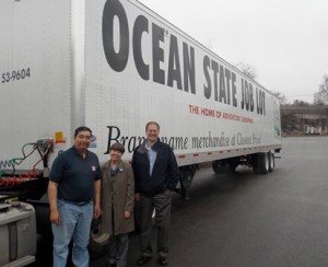 Worcester County Food Bank Executive Director Jean G. McMurray and Ocean State Job Lot Westborough Store Manager Bill Thayer (right) with the truck driver who delivered the donations Photo/Valerie Franchi 