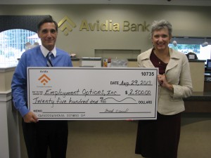 David Morticelli (left), AVP market manager of Avidia Bank presents a donation to Toni Wolf, executive director of Employment Options, Inc. (Photo/submitted)