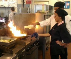Chef Ernie Sena prepares a dish with Culinary Art student Clara Maldonado of Clinton. (Photo/submitted)