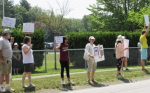 Local residents demand that ‘Families Belong Together’