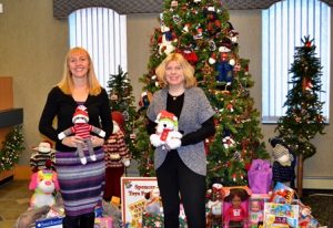 Jennifer Anderson, assistant vice president/mortgage loan officer (l) and Lynne Esposito, vice president/senior mortgage loan officer, both of SpencerBANK, pose with donations recently made at the bank’s main office drop-off location. Photo/submitted 