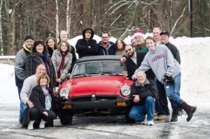 James Nifong (far right), with his family and some of those who helped restore an MGB for him as a surprise Christmas present Photo/courtesy Elizabeth Barry, Bits & Bridles Photography 