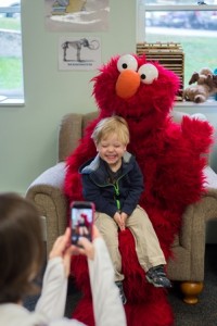  Jonah, 3, from Southborough sits for a picture with Elmo. 