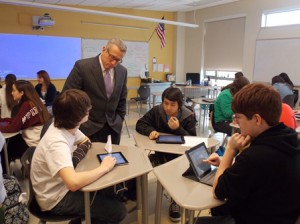 Mass. Education Commissioner Mitchell Chester observes sophomore students using their iPads in English class at Grafton High School. Photo/Valerie Franchi 