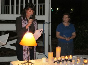 A volunteer speaks at the fourth annual candlelight vigil sponsored by ADVISE and Saheli.  Photo/Michael Gelbwasser  