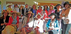 In keeping with the Kentucky Derby tradition, the WOW ladies expressed their inner Southern Belles with flamboyant hats at a May 2 party.  Photo/Joyce DeWallace  