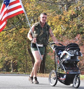 Seamus Shanley of Shrewsbury, a Marine Corp veteran and Worcester firefighter, approaches the finish line with his son Quinn, four months.