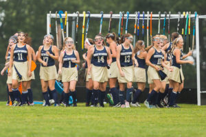 The Shrewsbury High School Field Hockey team warms up before a game against St. Peter-Marian. 