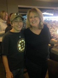 Shrewsbury mother Dawn King, founder of the nonprofit Friends With Heart, stands with her son Ben at a recent Bruins game outing with the Teen Meet group. (Photo/submitted)
