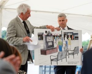 Howard Grossman and Mark Hebert of Grossman Development Group hold a artistic rendering of what the new Spag’s memorial will look like. Photo/courtesy Grossman Development Group 