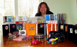 Melissa Misiewicz is surrounded with her growing collection of letterboxing paraphernalia. Photo/Joyce DeWallace  