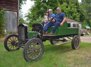 Joe Marsten gives a ride to his brother Jim and niece Angelina in his 1925 Model T, which starts with an “Armstrong starter” - a hand crank on the front. 